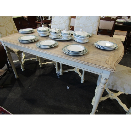 1133 - A 'Libra' limed oak effect and painted French style dining table with serpentine shape ends on turne... 