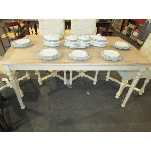 1133 - A 'Libra' limed oak effect and painted French style dining table with serpentine shape ends on turne... 