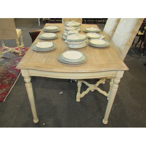 1133 - A 'Libra' limed oak effect and painted French style dining table with serpentine shape ends on turne... 