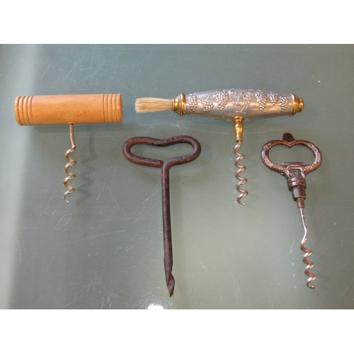 1198 - A collection of four vintage French corkscrews, including one with a brush