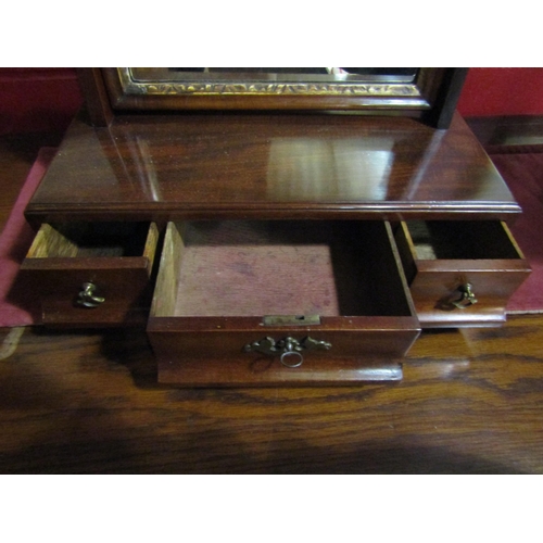 4029 - An early George III mahogany dressing chest toilet mirror with brass finials and gilt relief decorat... 