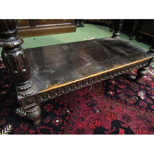 4071 - A 19th Century Jacobean style two-tier single drawer serving table, intricately carved frieze and su... 