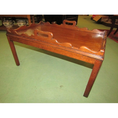 4010 - An oak butler's tray on stand with shaped gallery, fretwork handles, 42cm tall x 76cm long x 50cm wi... 