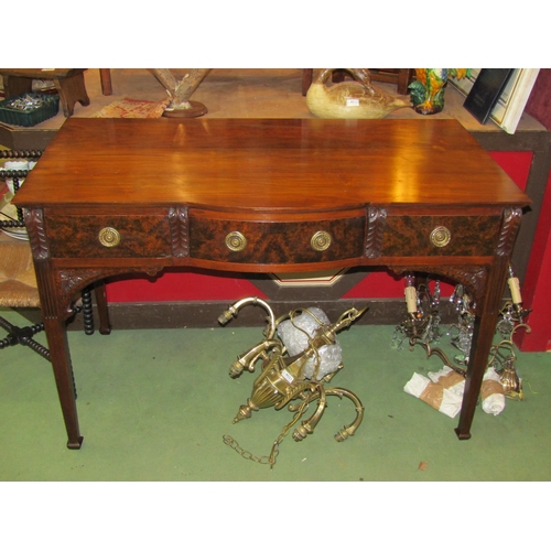 4020 - A Georgian walnut bow-fronted serving table the three frieze drawers and carved corbel decoration ov... 