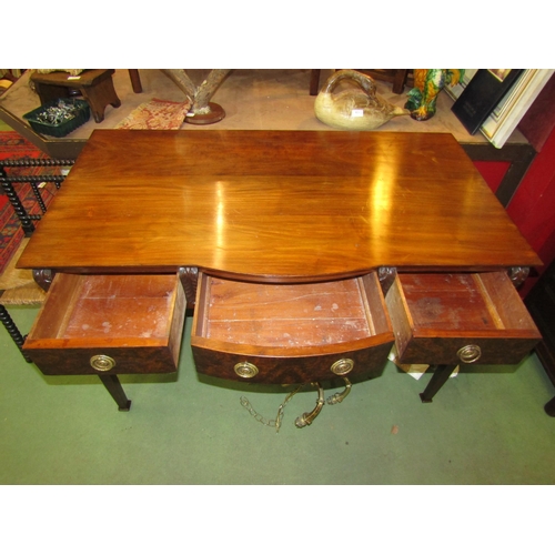 4020 - A Georgian walnut bow-fronted serving table the three frieze drawers and carved corbel decoration ov... 