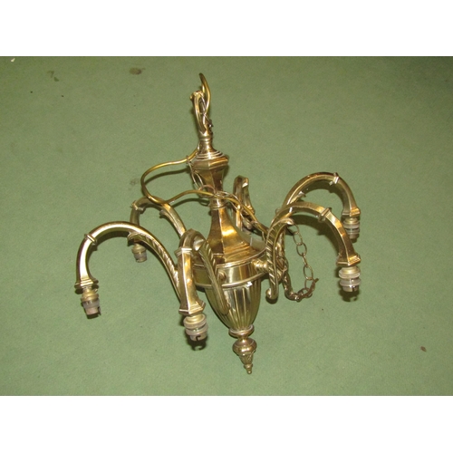 4021 - A brass six-arm electrolier, acanthus leaf details