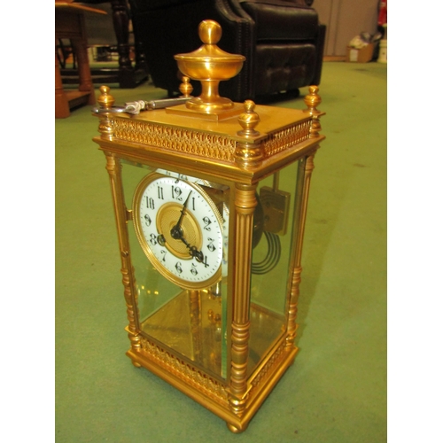 4030 - A late 19th Century French striking mantel clock in gilt metal case having four glass panels, with m... 