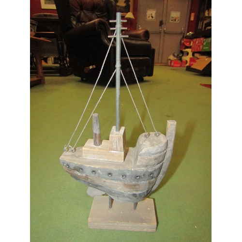 4044 - A hardwood model of a boat with mast, 34cm tall