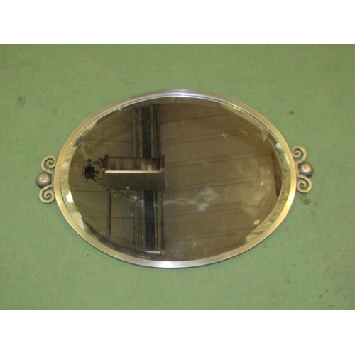 4056 - An Art Deco style metal framed oval bevelled glass mirror, 59cm wide