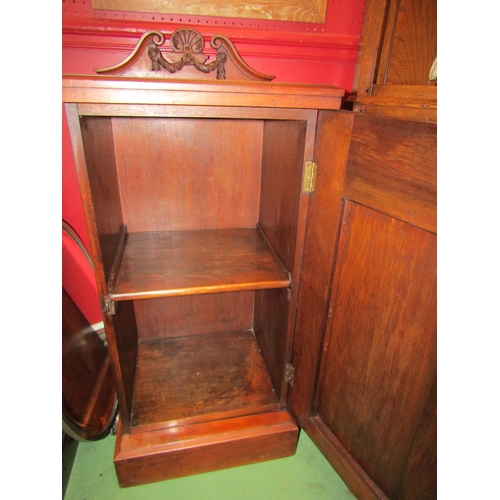 4057 - A Victorian carved walnut single door bedside cabinet with raised swan-neck back on a plinth base, 9... 