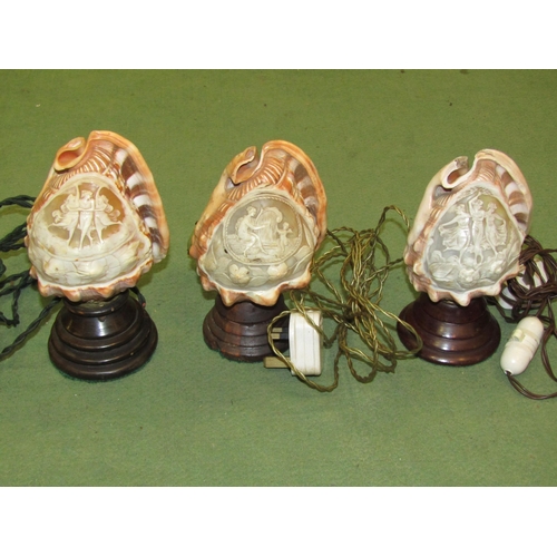 4059 - Three ornately carved cameo conch shell table lamps