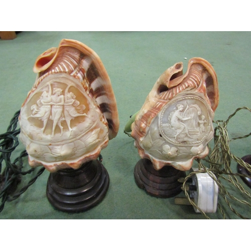 4059 - Three ornately carved cameo conch shell table lamps