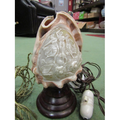 4059 - Three ornately carved cameo conch shell table lamps