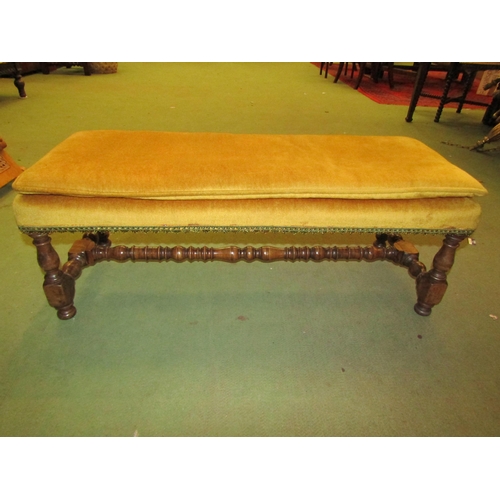 4077 - An 18th Century revival walnut duet footstool on turned baluster legs united by a conforming 