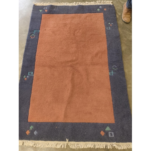 2564 - A hand woven Indian rug blue and salmon.  180 x 120