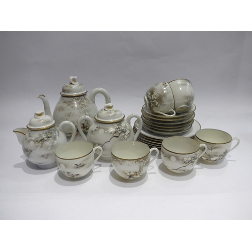 4483 - An Oriental eggshell six place teaset including cups/saucers, plates, teapot and milk jug, some depi... 