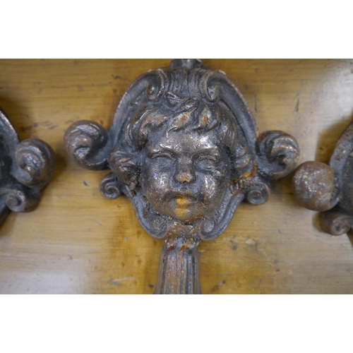 2017 - Five cast iron cherub head fixings