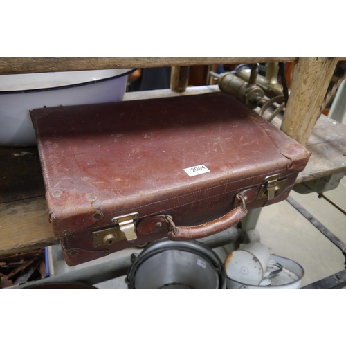 2064 - A small leather suitcase with blue interior