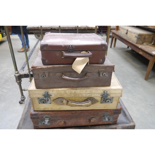 2069 - Four leather suitcases