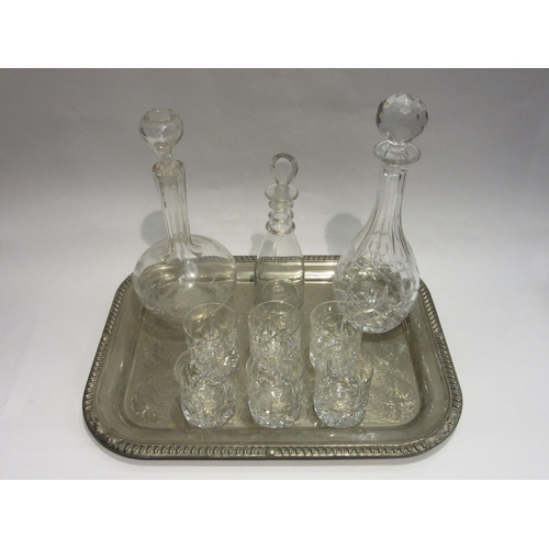 4488 - A fruiting vine engraved decanter, a cut glass decanter and one other, together with six tumblers al... 