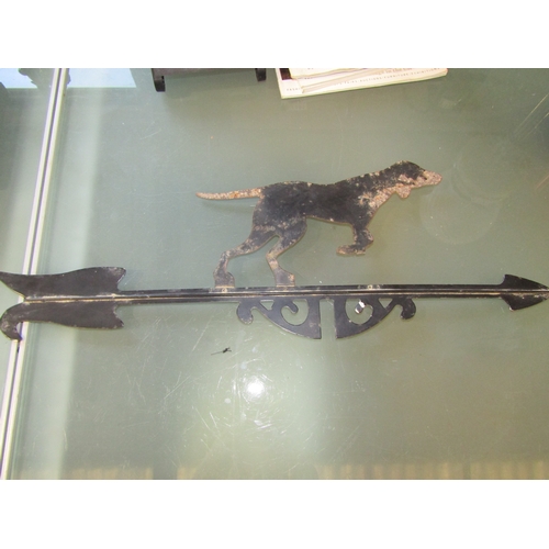 2061A - An antique French weather vane terminal in the form of a pointing black dog atop an arrow, 59cm x 18... 