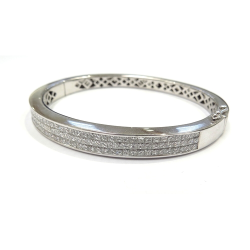 6027 - An 18ct white gold diamond hinged cocktail bangle set with 120 princess cut diamonds 4.20ct approx, ... 