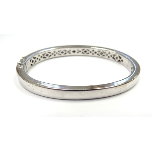 6027 - An 18ct white gold diamond hinged cocktail bangle set with 120 princess cut diamonds 4.20ct approx, ... 
