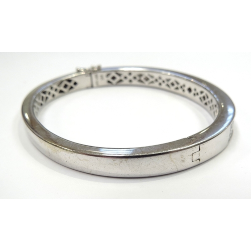 6027 - An 18ct white gold diamond hinged cocktail bangle set with 120 princess cut diamonds 4.20ct approx, ... 