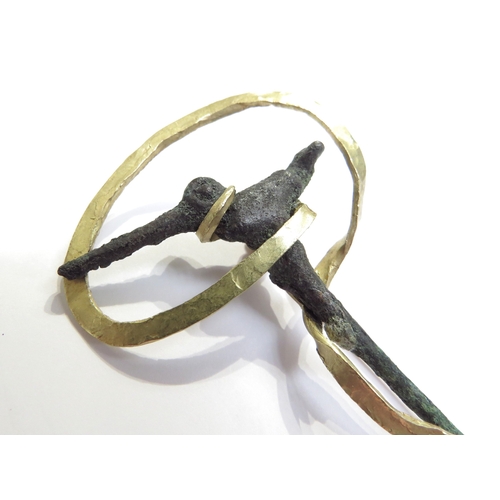 6061 - A bronze cloak pin as a bird with a later gold brooch mount stamped 18k, 8cm long, 16.5g