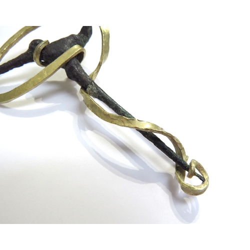 6061 - A bronze cloak pin as a bird with a later gold brooch mount stamped 18k, 8cm long, 16.5g