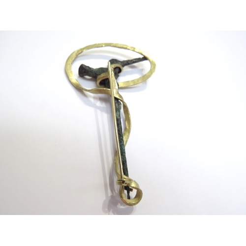 6061 - A bronze cloak pin as a bird with a later gold brooch mount stamped 18k, 8cm long, 16.5g