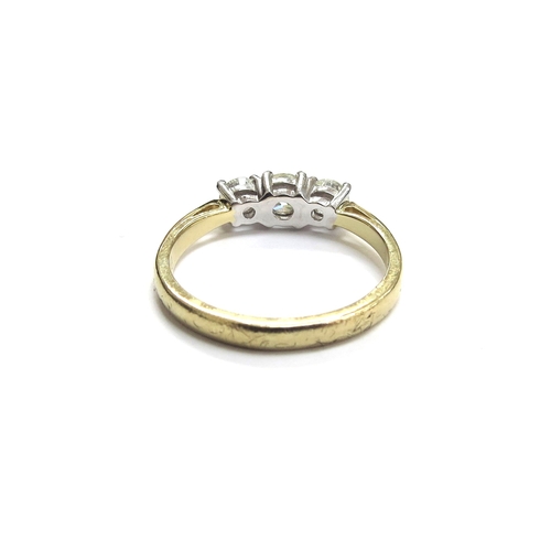 6002 - An 18ct gold three stone diamond ring, 0.83ct total, G/SI. Size 3.9g
