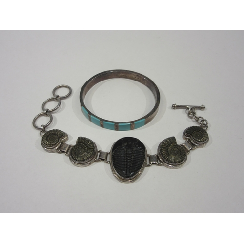 1329 - A silver hinged bangle and a 
