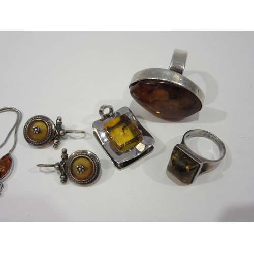1354 - A box of amber bijouterie rings, pendant and earrings