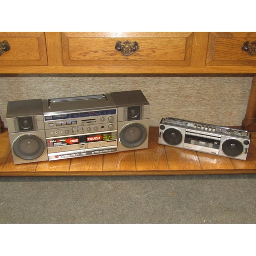 1144 - A vintage Aiwa CA-W10 cassette/radio ghetto blaster (damage to top) and a smaller Sanyo example (2)