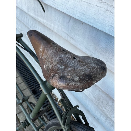 8118 - A BSA folding paratrooper / airborne forces bicycle, green painted frame with brown leather saddle. ... 