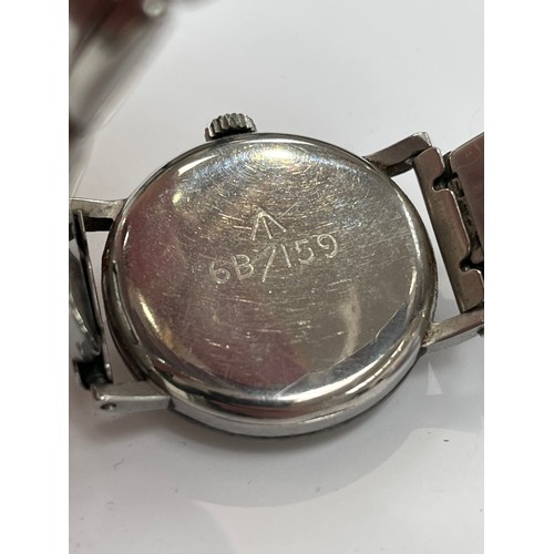 8393 - An Omega military issue wristwatch, stainless steel cased, discoloured dial with Arabic numerals and... 