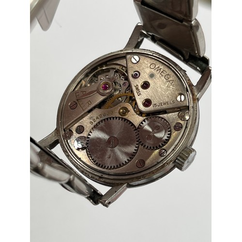 8393 - An Omega military issue wristwatch, stainless steel cased, discoloured dial with Arabic numerals and... 