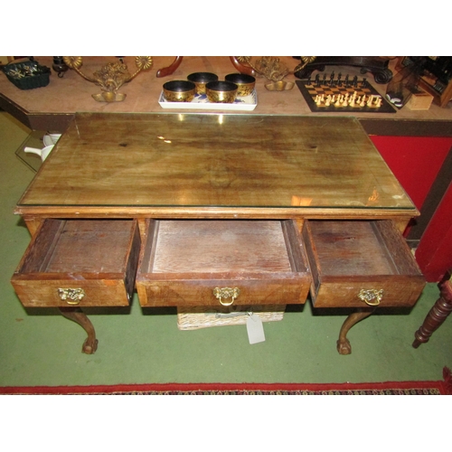 4003 - A walnut Queen Anne style desk, frieze drawer flanked by banks of two short drawers on cabriole legs... 