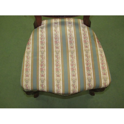 4050 - A pair of Victorian carved walnut spoon back chairs, the Serpentine front seat on French cabriole fo... 