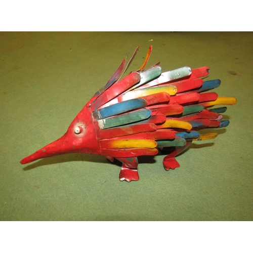 4044 - A tin plate model of a lion together with a painted model of a Porcupine, tallest 17cm (2)