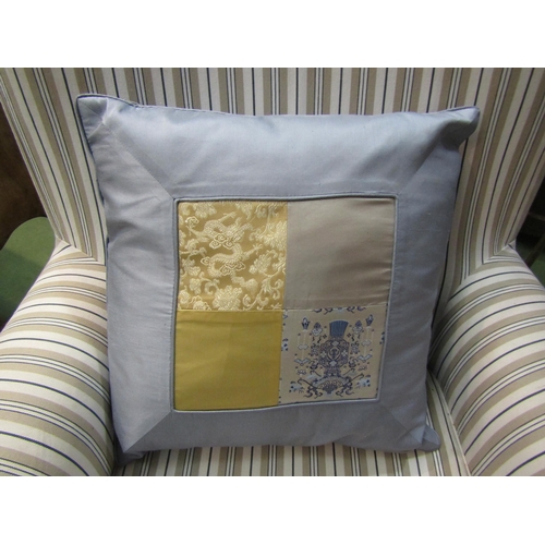 4052 - A Victorian style armchair with striped loose cover, the scroll arms over square tapering feet