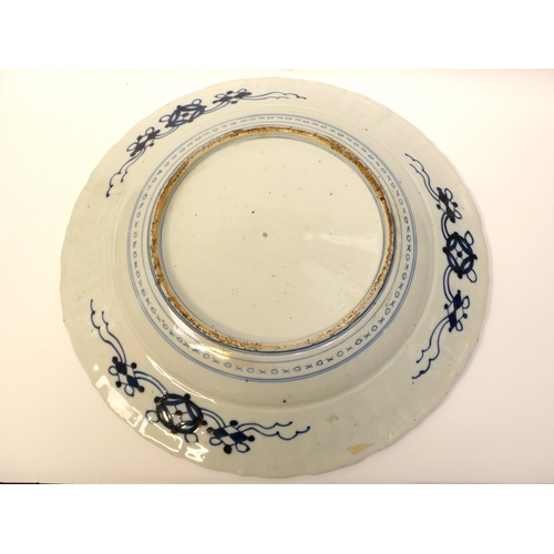 4018 - A pair of 19th Century Chinese ceramic chargers of large proportions. A panelled border surrounding ... 