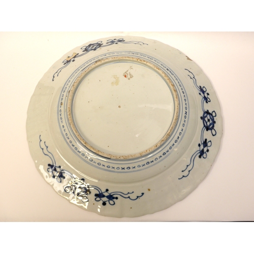 4018 - A pair of 19th Century Chinese ceramic chargers of large proportions. A panelled border surrounding ... 