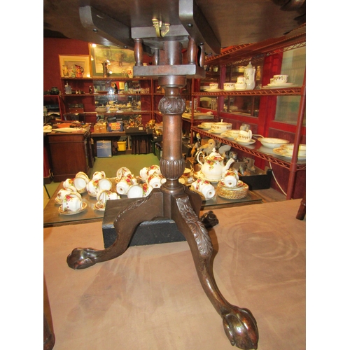 4007 - A Chippendale style carved mahogany pie crust edge revolving tilt-top table on carved tripod base wi... 