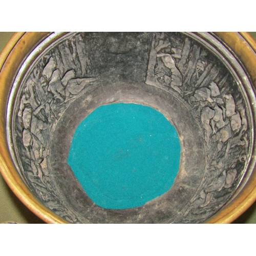 4014 - An embossed brass planter with scenes of children gathered by a fire, lion mask ring handles, 35cm d... 