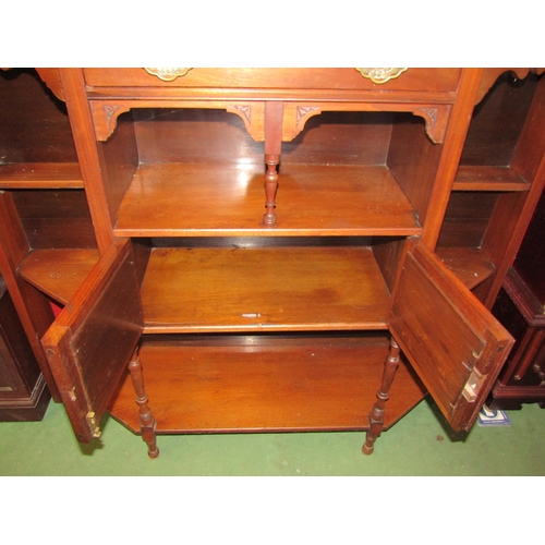 4017 - A mahogany hall cupboard base, canted corners, shelved with mirrored door central cupboards and sing... 