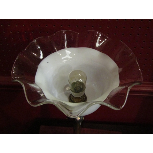 4030 - A brass stick form table lamp, petal detail, frilled white/clear glass shade, 44cm height