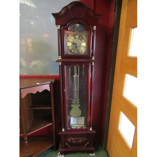 4025 - An Emperor mahogany longcase clock with two weights and a pendulum, atlas detail to face