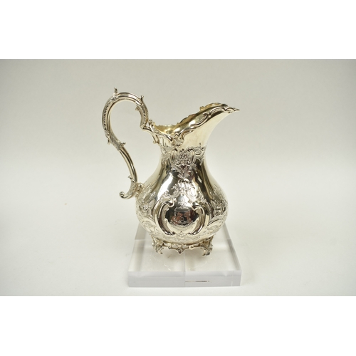 8009 - A Martin, Hall & Co. Victorian silver four piece tea set of highly ornate form.  Both pots lids are ... 